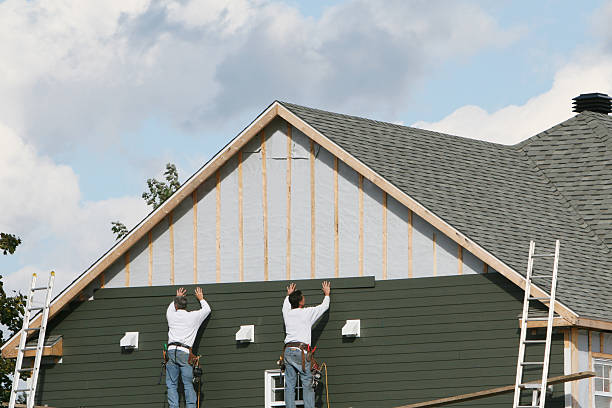 Professional Siding technician working in White, PA